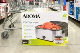 aroma roaster on floor in front of walmart cart in aisle