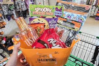 halloween basket full of candy, stickers, coloring book and more