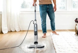 person using the Shark Steam and Scrub Mop on hardwood floors