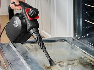 a steamer cleaning an oven