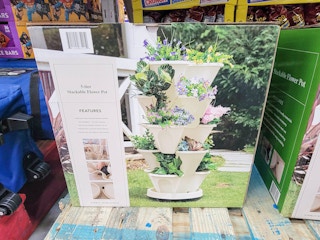 a 5 tier stackable tan colored flower pot