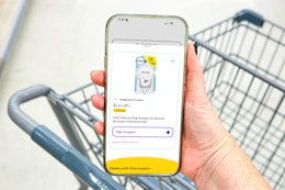 hand holding a smartphone displaying a 1-clip coupon in the kcl app