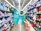 hand holding a stem insect trap in a walmart aisle