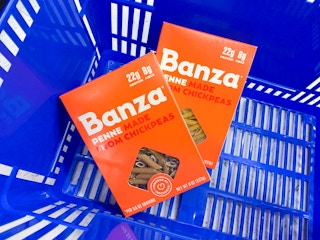 two boxes of banza pasta in walmart hand basket