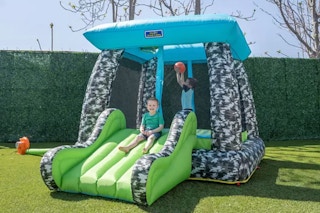 lifestyle image of children playing in a bounce house