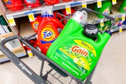 large tide and gain detergent bottles in a cart