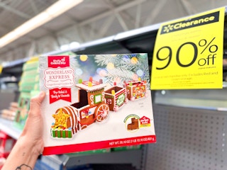 hand holding wonderland express in walmart aisle