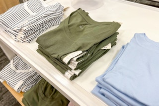 Folded women's tops on display in Target store