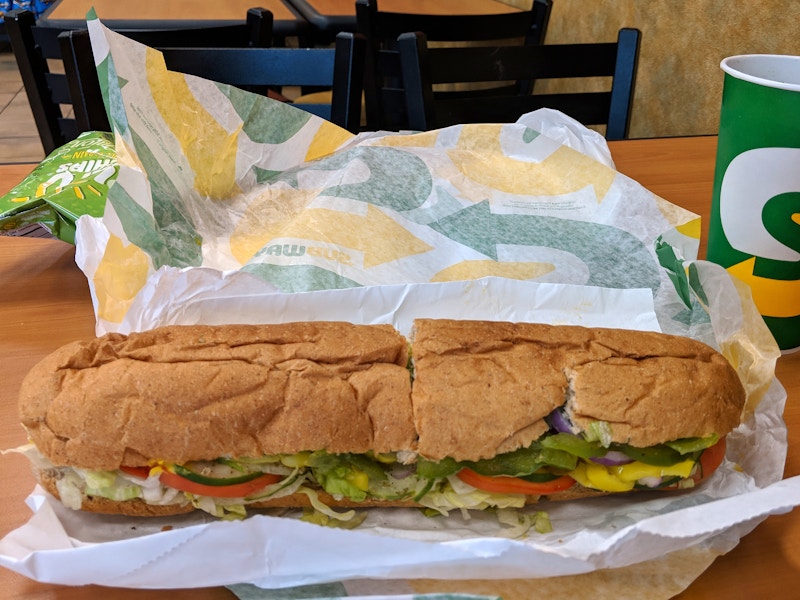 A footlong Sub, drink and chips at Subway