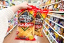hand holding bags of on the border chips
