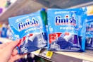 hand grabbing a bag of finish dish tabs