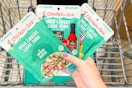 hand holding chicken of the sea tuna pouches