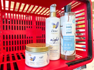 dove and love beauty and planet products in a red basket