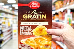 hand holding a box of betty crocker potatoes