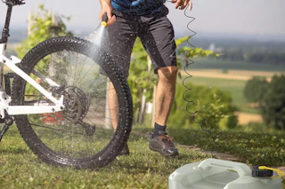 a man using an electric sprayer