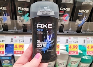hand holding axe deodorant