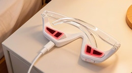 a under-eye red light device charging on a nightstand