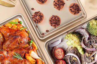 a set of three baking pans with food