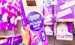 Swiffer Powermop Kit held up in Walmart store aisle (sponsored)