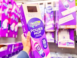 Swiffer Powermop Kit held up in Walmart store aisle (sponsored)