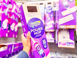 Swiffer Powermop Kit held up in Walmart store aisle (sponsored)