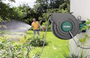 a retractable garden hose the outside of a house
