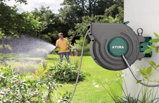 a retractable garden hose the outside of a house