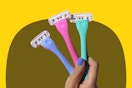 B0DGHVZPQK Billie Womens Razors - A hand holds a sky blue, bright pink, and seafoam green razor 
