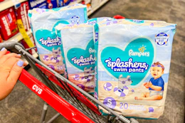 hand pushing cvs cart with pampers splashers swim diapers