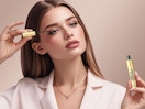 a woman applying eyelash serum
