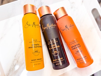 3 SheaMoisture hair products laying in a marble print tray