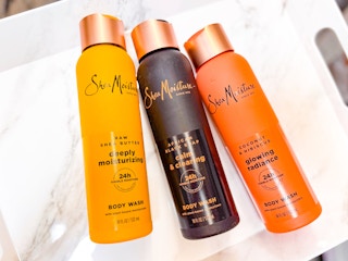 3 SheaMoisture hair products laying in a marble print tray