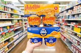 hand holding kraft and velveeta cups