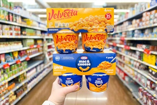 hand holding kraft and velveeta cups