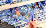 hand grabbing marvel oreo cookies off a target shelf