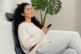 someone using a back massager