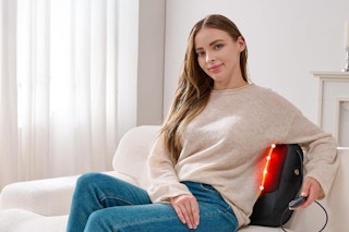 Woman using the KNQZE 3-in-1 Shiatsu Back Massager.