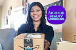 a woman holding an amazon delivery box
