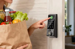woman using Smart Door Lock to open up door