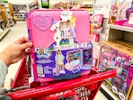 polly pocket resort rollaway playset sitting on top a target cart