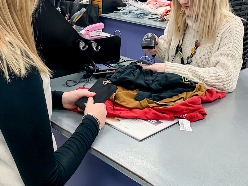 Person checking out at plato's closet