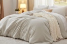  Bedsure Queen Size Comforter Set, Beige Soft Prewashed Bedding for All Seasons bedroom setting.