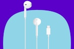 Apple EarPods Headphones with USB-C Plug on a blue background.