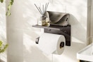 a toilet paper holder on a wall