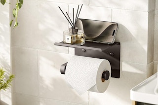 a toilet paper holder on a wall