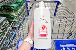 hand holding a bottle of dove body wash