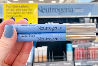someone holding neutrogena mascara in front of neutrogena shelf at cvs
