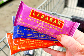 hand holding larabar single bars