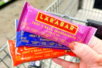 hand holding larabar single bars