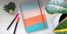sweetzer and orange daily planner with pens and and plants